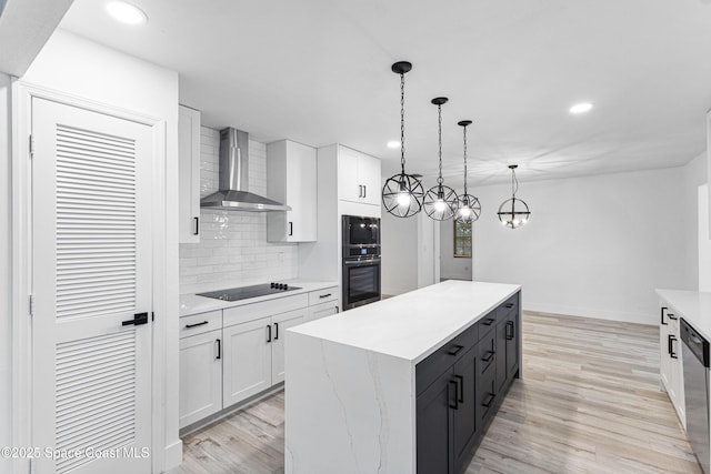 4890 Yew Ct, Titusville, FL 32796 - kitchen featuring wall chimney range hood, appliances with stainless steel finishes, white cabinets, backsplash, and light wood-style flooring