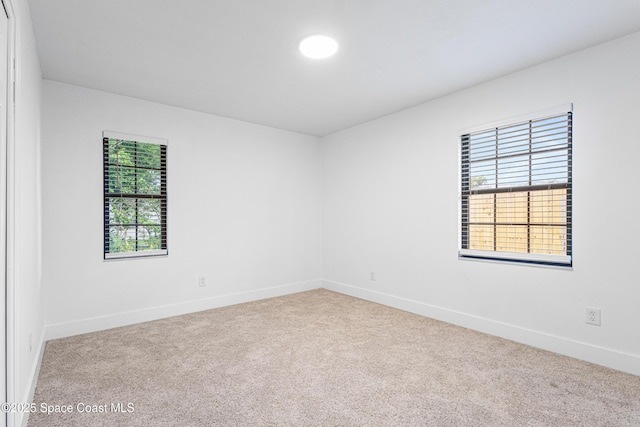 4890 Yew Ct, Titusville, FL 32796 - spare room featuring carpet floors and baseboards