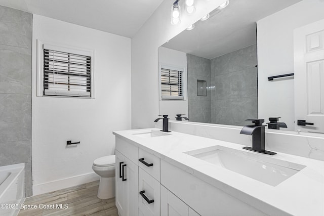 4890 Yew Ct, Titusville, FL 32796 - full bathroom with double vanity and wood finished floors