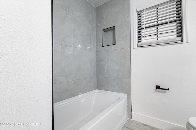 4890 Yew Ct, Titusville, FL 32796 - bathroom with a tub and wood finished floors