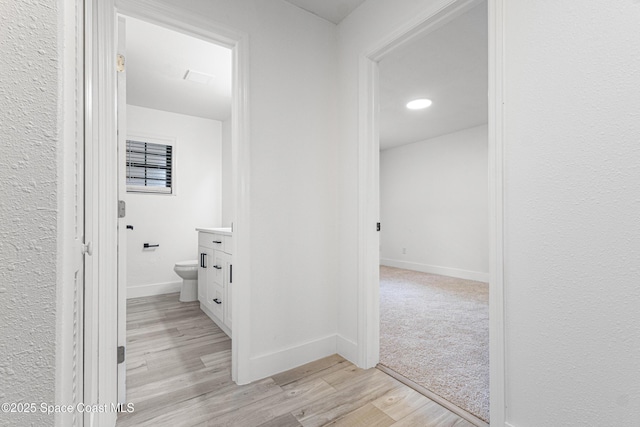4890 Yew Ct, Titusville, FL 32796 - hallway with light wood finished floors and baseboards