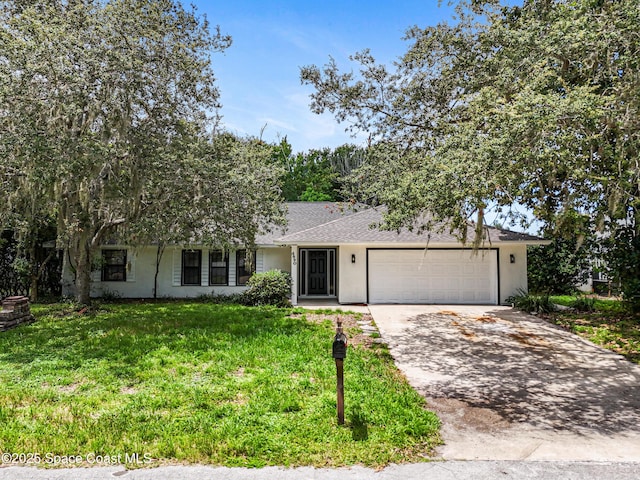 4890 Yew Ct, Titusville, FL 32796 - view of front of home with concrete driveway, stucco siding, an attached garage, a front yard, and roof with shingles