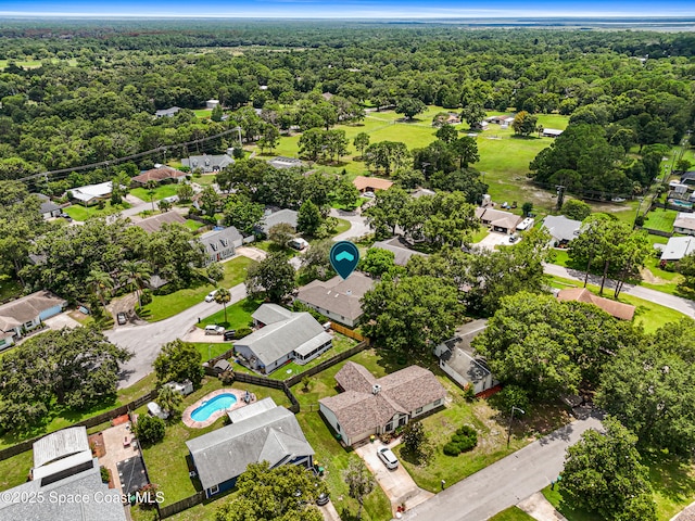 4890 Yew Ct, Titusville, FL 32796 - aerial view of residential area featuring a heavily wooded area and a pool