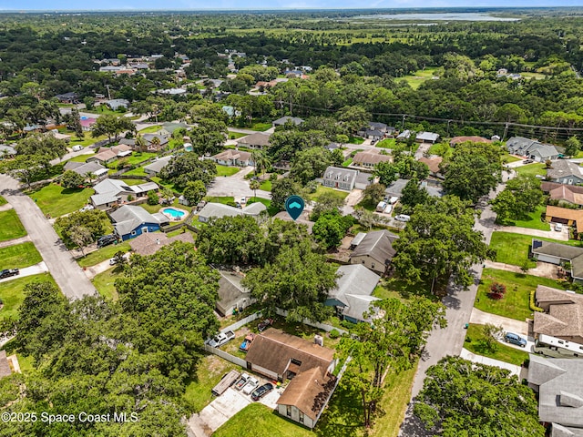 4890 Yew Ct, Titusville, FL 32796 - aerial perspective of suburban area with a forest