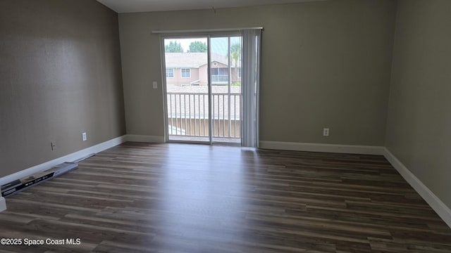 1820 Long Iron Dr Unit 525, Rockledge, FL 32955 - spare room with dark wood finished floors
