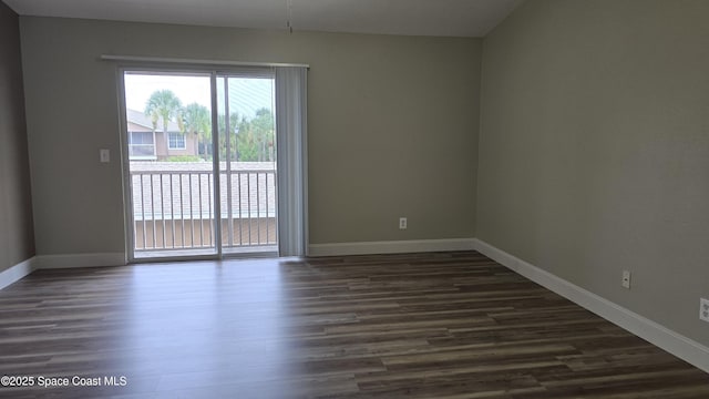 1820 Long Iron Dr Unit 525, Rockledge, FL 32955 - empty room with dark wood finished floors and baseboards