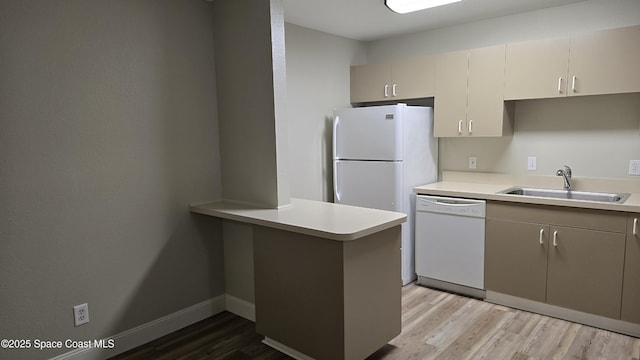 1820 Long Iron Dr Unit 525, Rockledge, FL 32955 - kitchen with dishwasher, light wood-type flooring, light countertops, and a peninsula