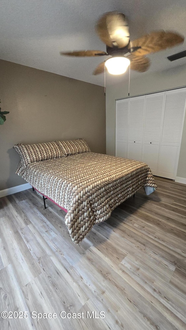 1820 Long Iron Dr Unit 525, Rockledge, FL 32955 - bedroom featuring wood finished floors, a closet, and a ceiling fan