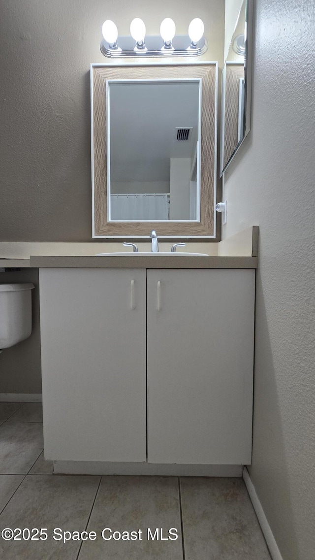 1820 Long Iron Dr Unit 525, Rockledge, FL 32955 - bathroom with tile patterned flooring and vanity