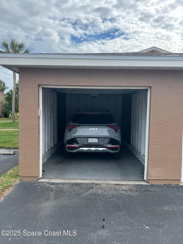1820 Long Iron Dr Unit 525, Rockledge, FL 32955 - garage with driveway