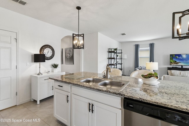 1669 Mineral Loop Dr NW, Palm Bay, FL 32907 - kitchen featuring dishwasher, open floor plan, white cabinets, a chandelier, and light tile patterned floors