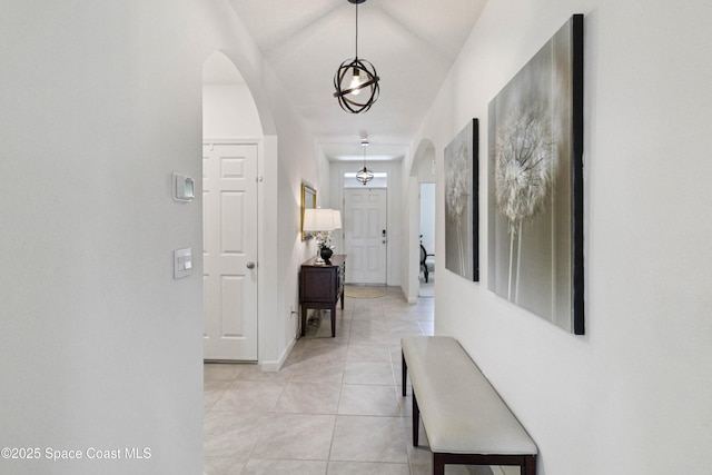 1669 Mineral Loop Dr NW, Palm Bay, FL 32907 - hall featuring arched walkways and light tile patterned floors