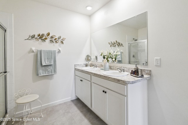 1669 Mineral Loop Dr NW, Palm Bay, FL 32907 - full bathroom featuring a shower with shower door, tile patterned flooring, and double vanity