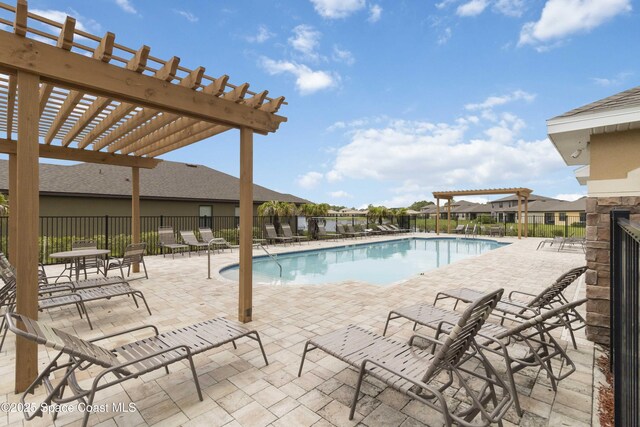 1669 Mineral Loop Dr NW, Palm Bay, FL 32907 - community pool featuring a pergola and a patio area
