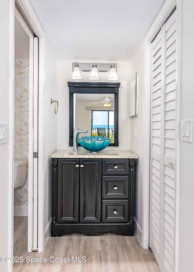 8496 Ridgewood Ave Unit 3205, Cape Canaveral, FL 32920 - bathroom featuring wood finished floors, vanity, and a closet