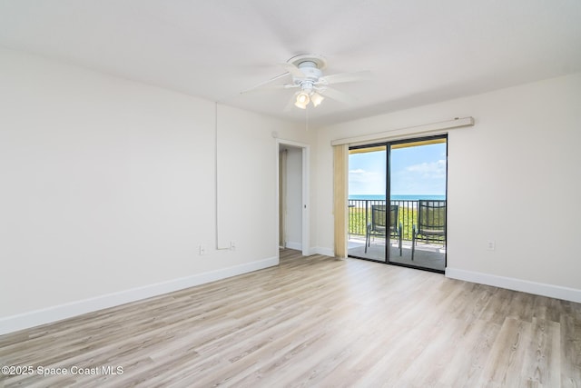 8496 Ridgewood Ave Unit 3205, Cape Canaveral, FL 32920 - empty room featuring light wood finished floors and a ceiling fan