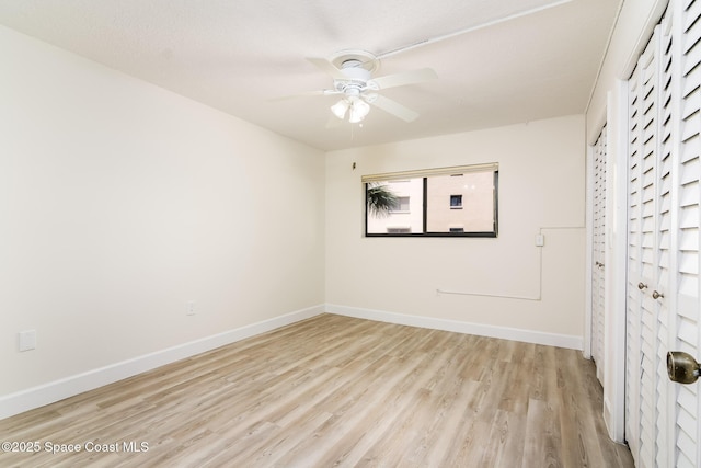 8496 Ridgewood Ave Unit 3205, Cape Canaveral, FL 32920 - unfurnished bedroom with light wood-type flooring and a ceiling fan