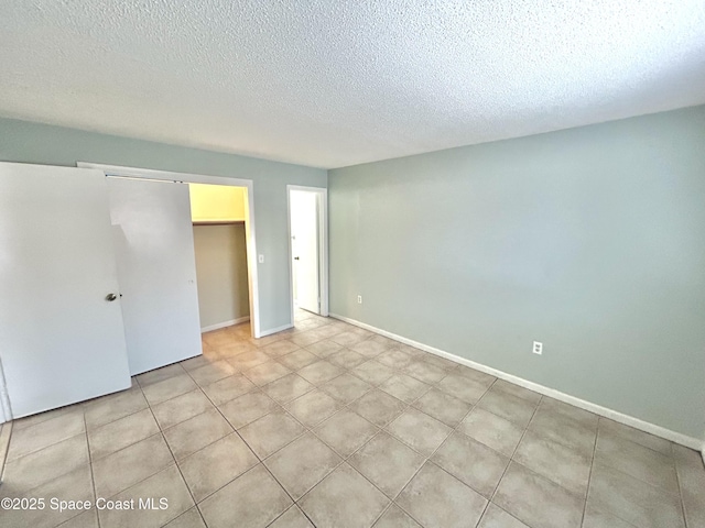 176 San Juan Cir, Melbourne, FL 32935 - unfurnished bedroom featuring a textured ceiling and a closet