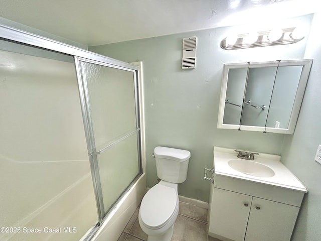 176 San Juan Cir, Melbourne, FL 32935 - full bath with vanity, bath / shower combo with glass door, and tile patterned flooring