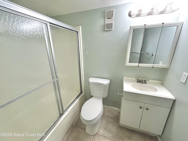 176 San Juan Cir, Melbourne, FL 32935 - full bathroom featuring vanity, tile patterned flooring, and enclosed tub / shower combo