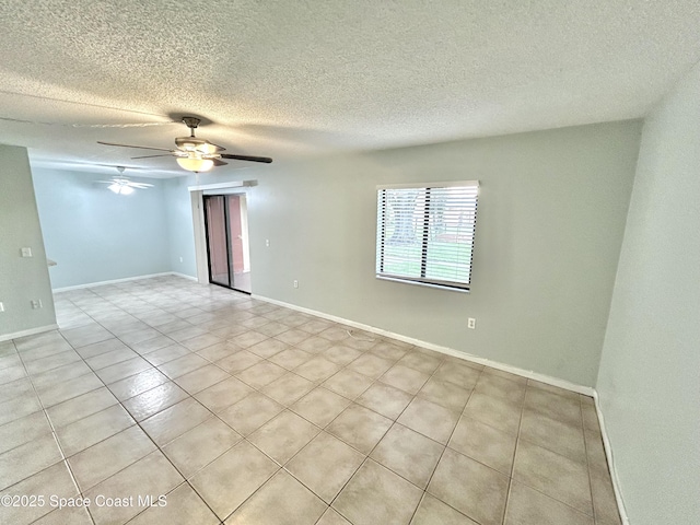 176 San Juan Cir, Melbourne, FL 32935 - empty room with a ceiling fan, light tile patterned flooring, and a textured ceiling