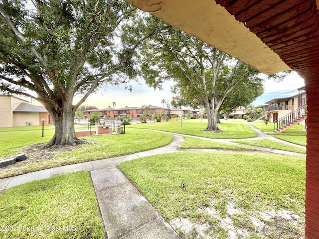 176 San Juan Cir, Melbourne, FL 32935 - view of home's community featuring a lawn and a residential view
