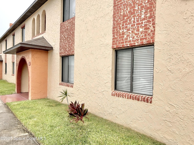 176 San Juan Cir, Melbourne, FL 32935 - view of home's exterior with stucco siding