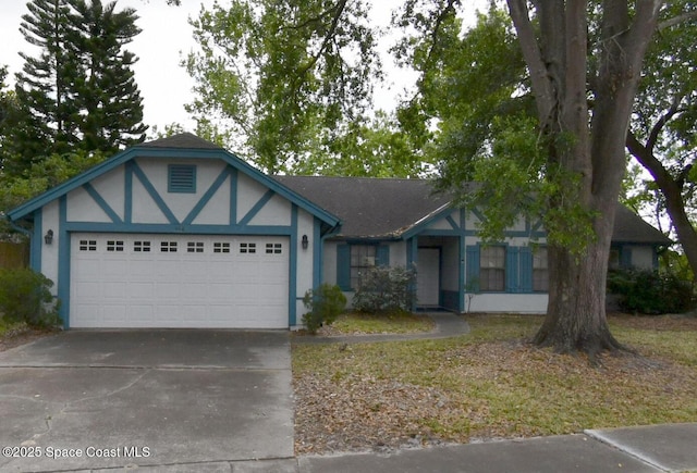 448 Autumn Oaks Pl, Lake Mary, FL 32746 - view of front of home featuring an attached garage, concrete driveway, and stucco siding
