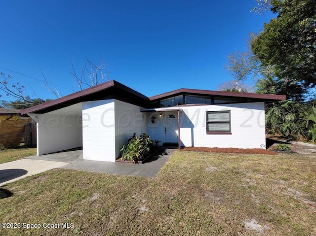 2158 Laden Rd, Melbourne, FL 32935 - view of front facade with a front yard and driveway