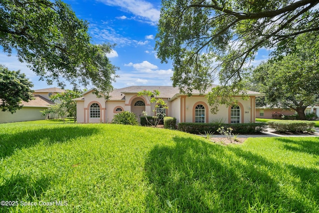 3912 Snowy Egret Dr, Melbourne, FL 32904 - mediterranean / spanish-style home featuring stucco siding and a front yard