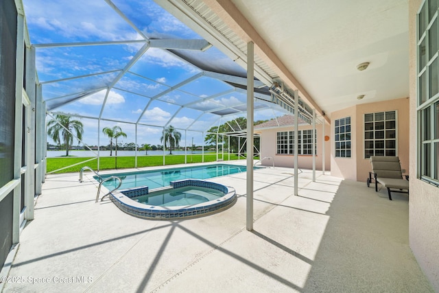 3912 Snowy Egret Dr, Melbourne, FL 32904 - view of pool with a patio area, a pool with connected hot tub, a yard, and glass enclosure