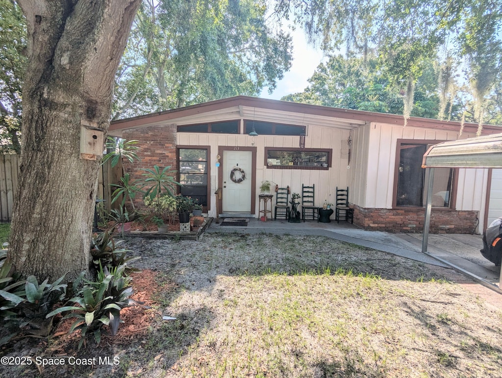 213 Lagrange Ave, Titusville, FL 32796 - view of front of house with stone siding