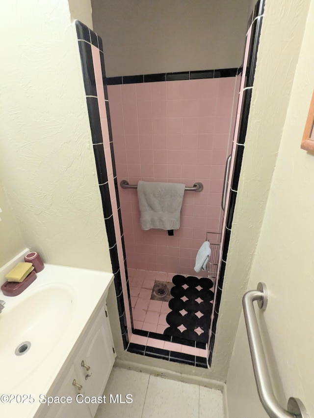 213 Lagrange Ave, Titusville, FL 32796 - full bathroom featuring a stall shower, vanity, and a textured wall