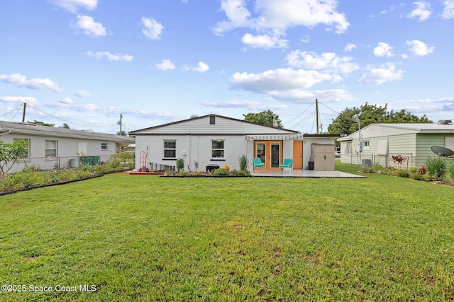 312 Tulip Ln, Melbourne, FL 32901 - back of property with french doors