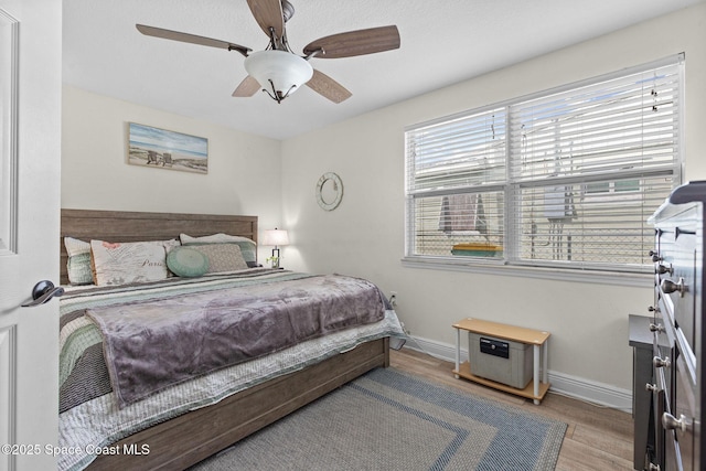 312 Tulip Ln, Melbourne, FL 32901 - bedroom featuring wood finished floors and ceiling fan