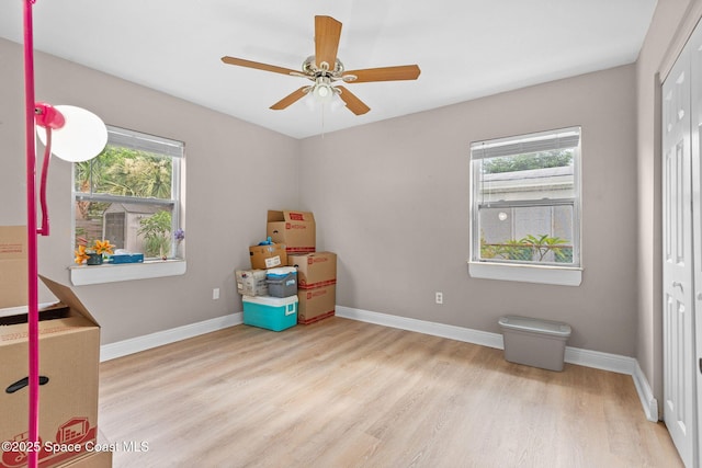 312 Tulip Ln, Melbourne, FL 32901 - unfurnished bedroom featuring wood finished floors, a closet, and ceiling fan