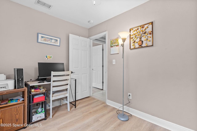 312 Tulip Ln, Melbourne, FL 32901 - home office featuring light wood-style flooring and baseboards