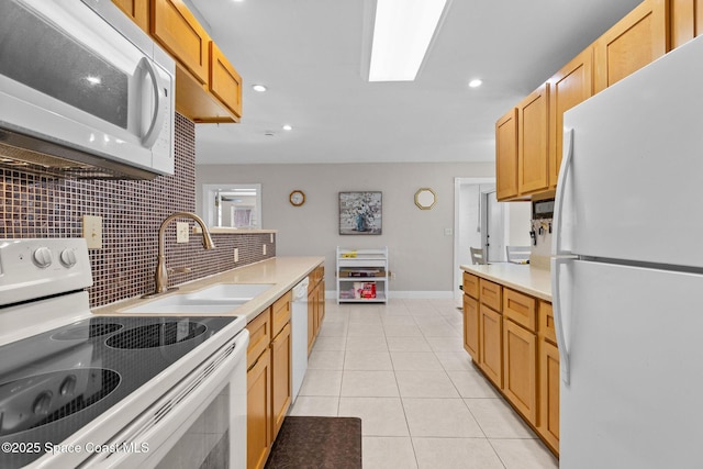 312 Tulip Ln, Melbourne, FL 32901 - kitchen featuring white appliances, light countertops, decorative backsplash, light tile patterned flooring, and recessed lighting