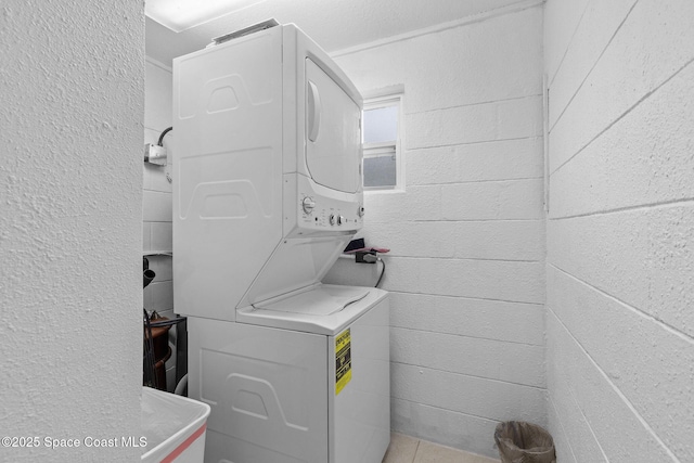 312 Tulip Ln, Melbourne, FL 32901 - laundry room featuring stacked washer / dryer
