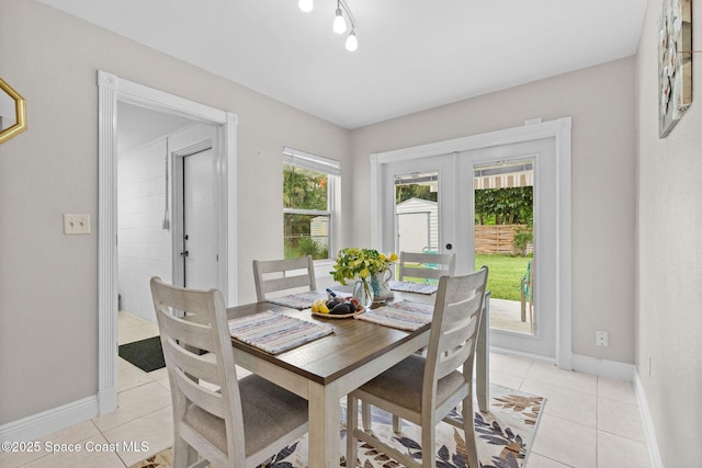312 Tulip Ln, Melbourne, FL 32901 - dining room featuring french doors and light tile patterned flooring