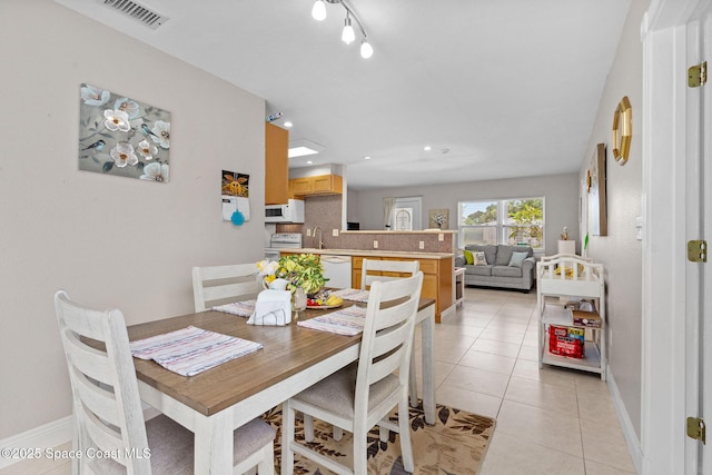 312 Tulip Ln, Melbourne, FL 32901 - dining room with light tile patterned flooring and recessed lighting