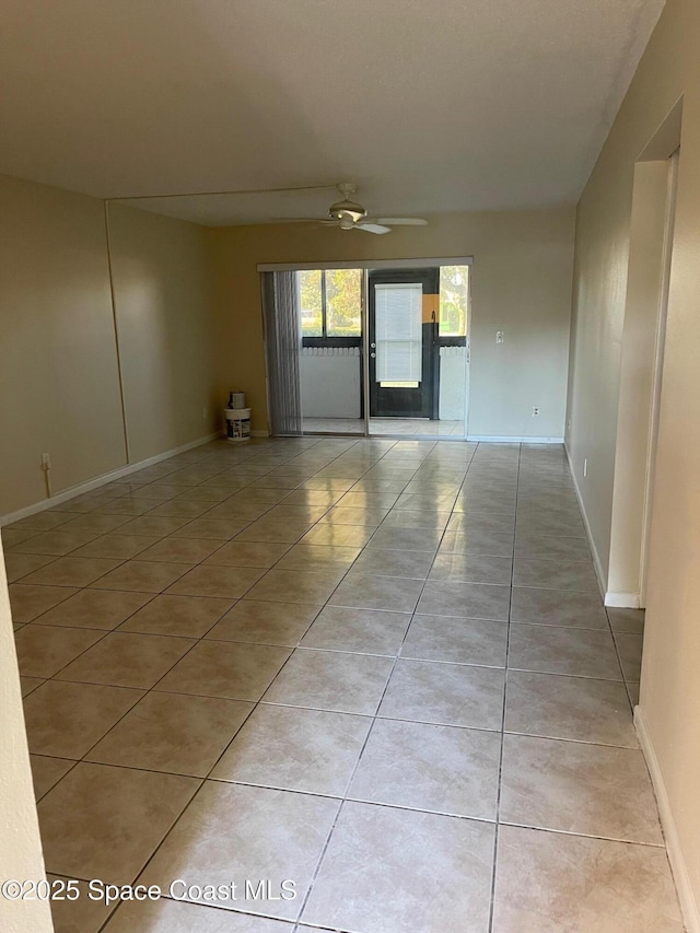 725 Port Malabar Blvd NE, Palm Bay, FL 32905 - spare room featuring light tile patterned floors and ceiling fan