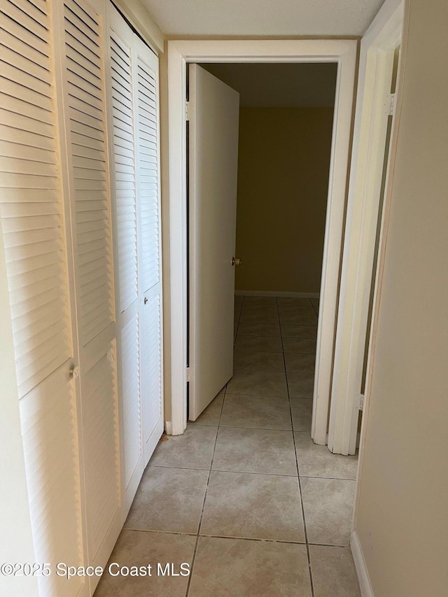 725 Port Malabar Blvd NE, Palm Bay, FL 32905 - corridor with light tile patterned floors and baseboards