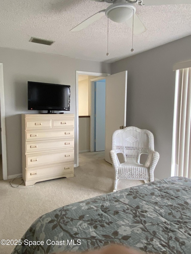 3343 Sandy Reef Ct, Melbourne Beach, FL 32951 - bedroom featuring light colored carpet, a textured ceiling, and a ceiling fan
