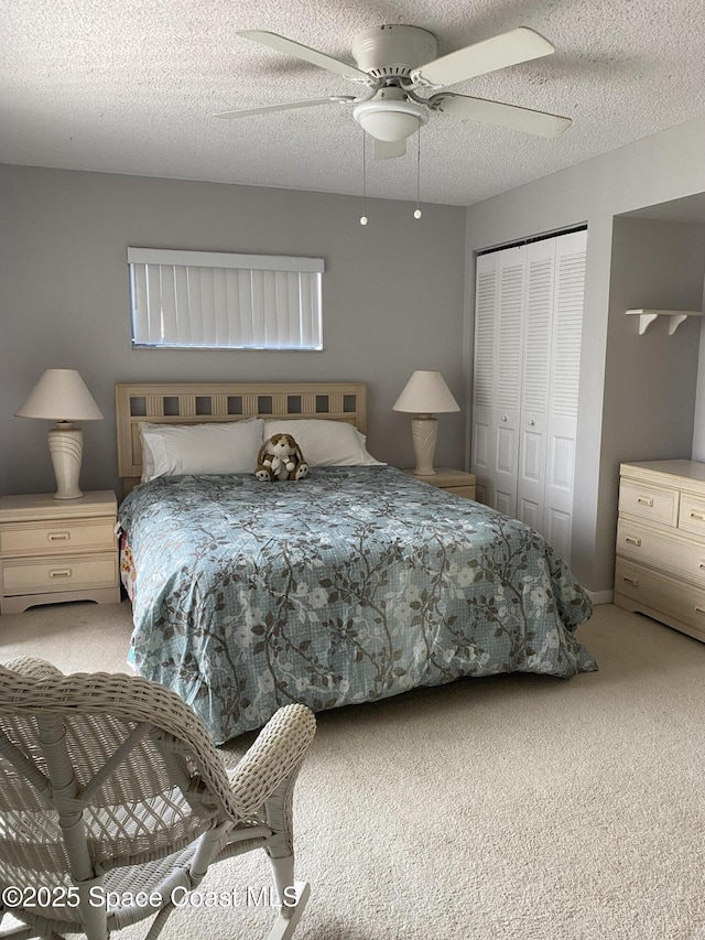 3343 Sandy Reef Ct, Melbourne Beach, FL 32951 - bedroom with carpet, a closet, ceiling fan, and a textured ceiling