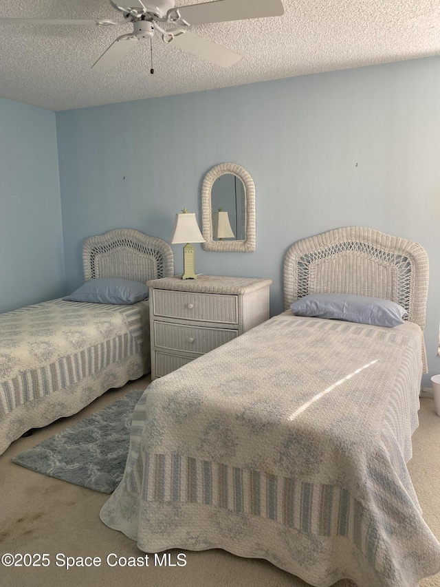 3343 Sandy Reef Ct, Melbourne Beach, FL 32951 - carpeted bedroom featuring a ceiling fan and a textured ceiling