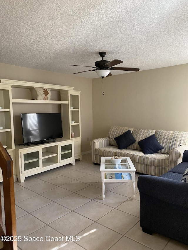 3343 Sandy Reef Ct, Melbourne Beach, FL 32951 - living area with ceiling fan, tile patterned floors, and a textured ceiling