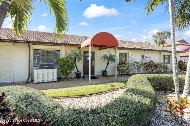 3343 Sandy Reef Ct, Melbourne Beach, FL 32951 - mediterranean / spanish house with stucco siding and a tile roof