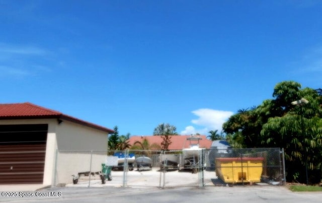 3343 Sandy Reef Ct, Melbourne Beach, FL 32951 - view of parking / parking lot with a gate