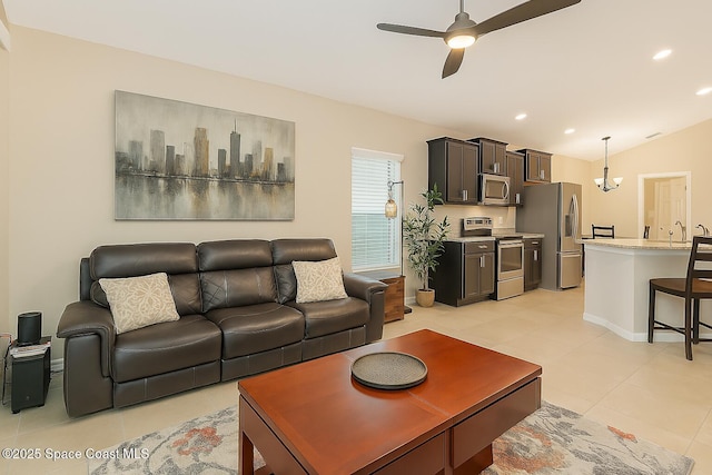 2097 Attilburgh Blvd, Melbourne, FL 32904 - living room with light tile patterned flooring, a ceiling fan, recessed lighting, and vaulted ceiling